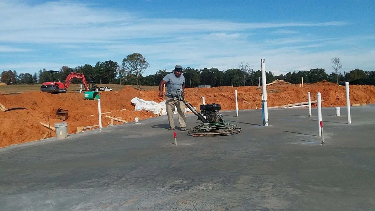 Power trowel finishing a large concrete slab